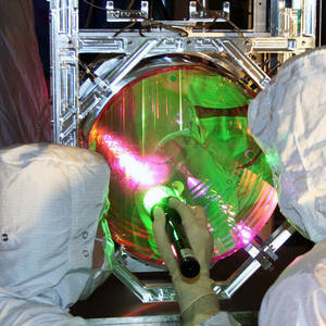 LIGO optic technicians examine one of the Laser Interferometer Gravitational-Wave Observatory's mirrors.