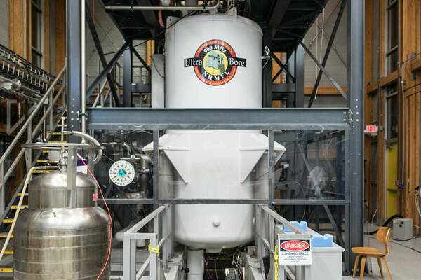 The 900MHz 105mm Ultra Wide Bore Magnet at the National High Magnetic Field Laboratory is seen here within a metal rigging structure.