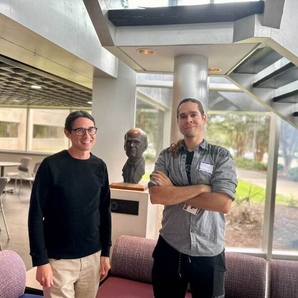 Don Brower and David Butcher stand together in a common area of MagLab.